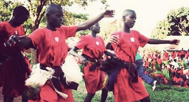 Traditional dance by local students in Kampala